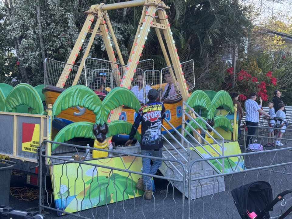 Families enjoying the pirate ship carnival ride
