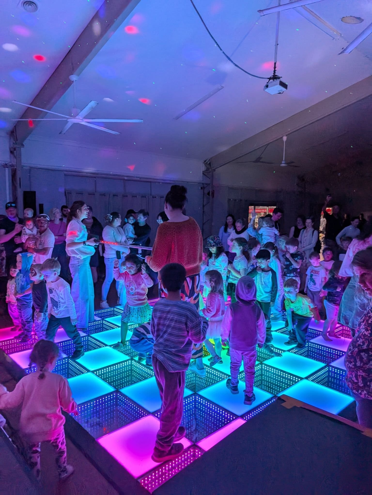 Kids dancing on the LED disco floor